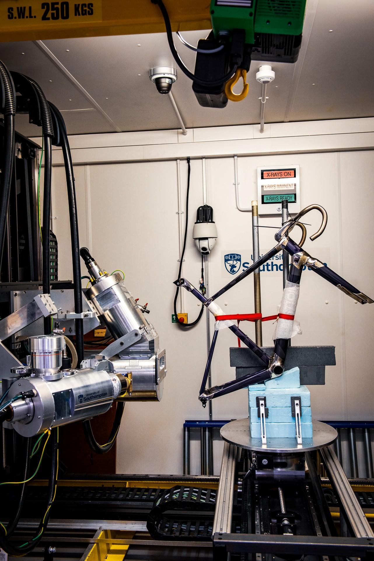 Cycling wind-tunnel rig with a bike mounted on a test platform inside a lab