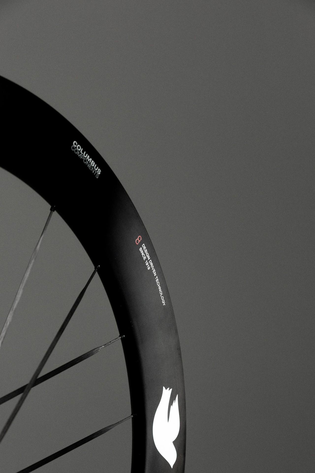 Close-up of the Columbus Cento 62 carbon wheel’s deep rim, spokes and white Columbus logo