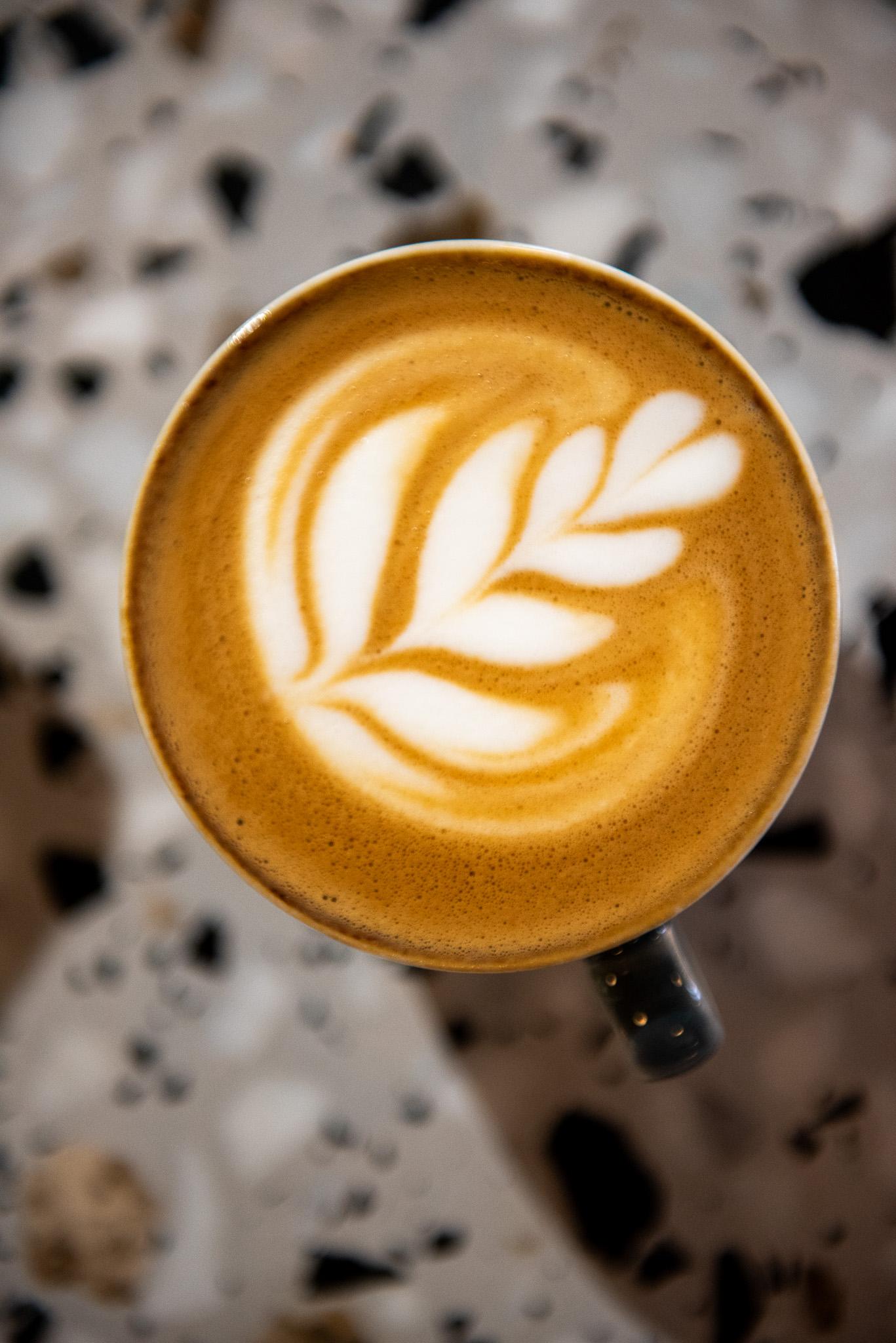 A vertical shot of a cup of coffee at the Clubhouse