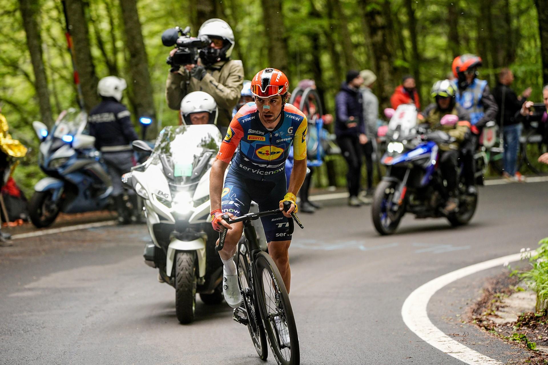 Giulio Ciccone rides at the front of a group of cyclists during a road race.