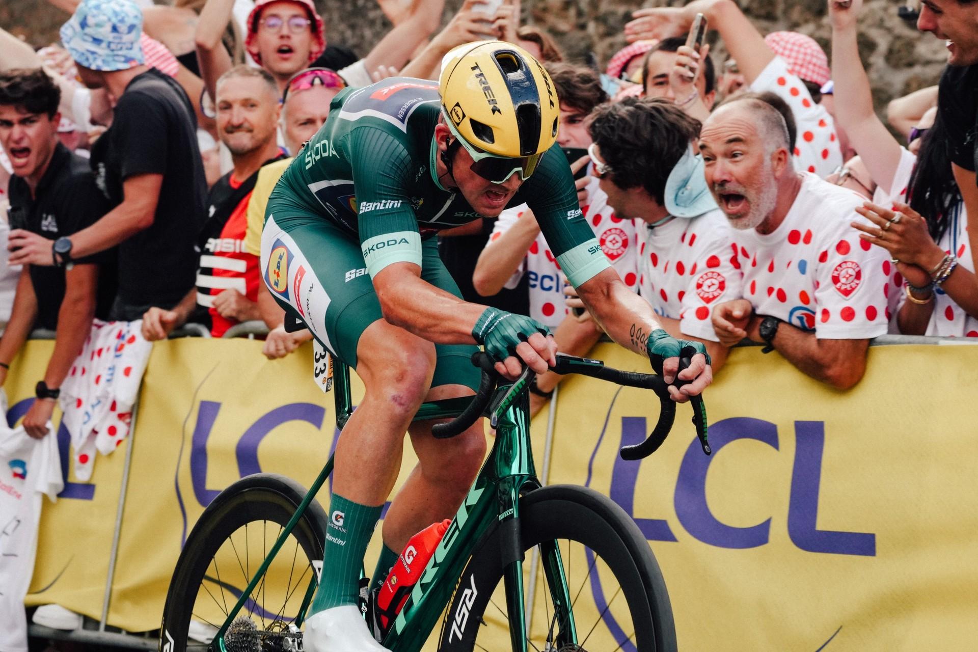 Mads Pedersen of Lidl-Trek rides past cheering fans during the Tour de France.