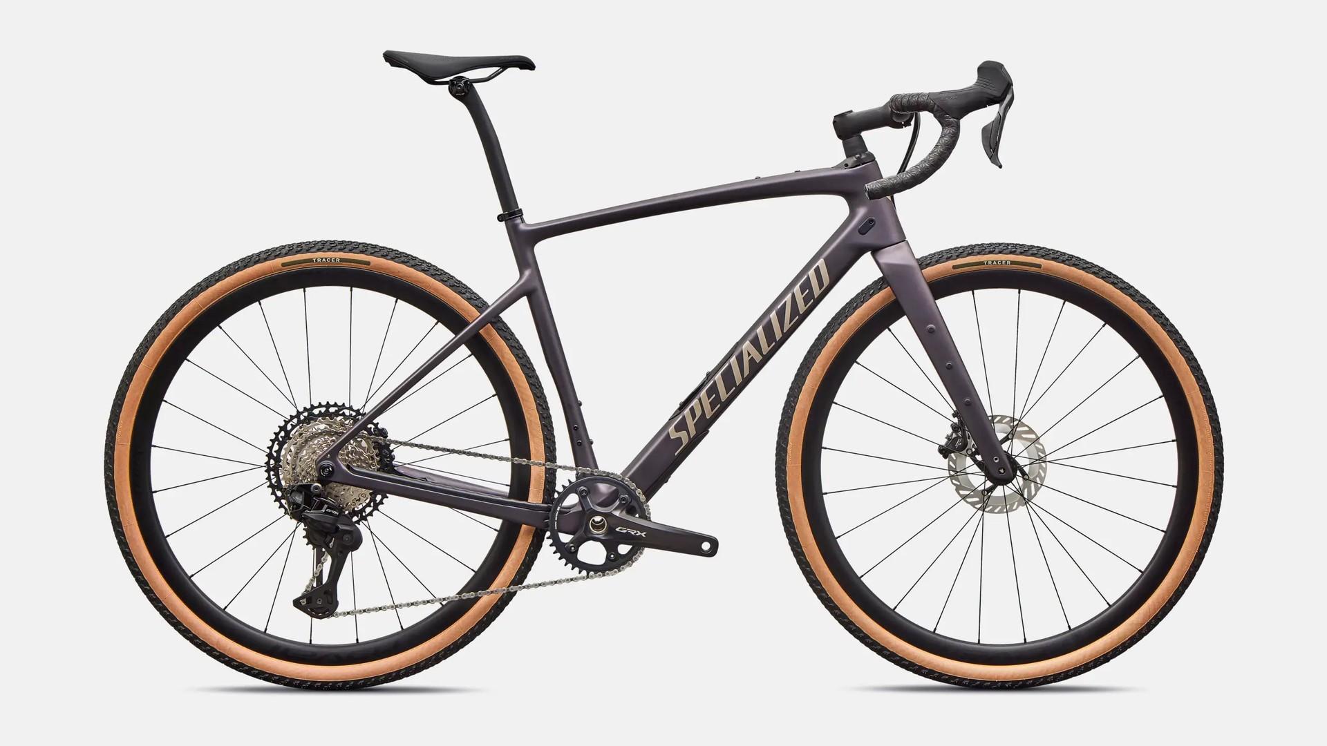 Side view of a dark Specialized gravel bike with drop handlebars and tan-sidewall tires.