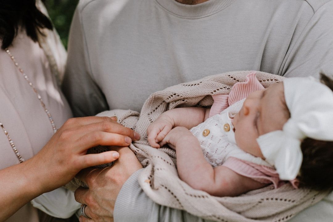 Close-up of a soft, organic cotton baby sleepsuit with a protective zipper cover.