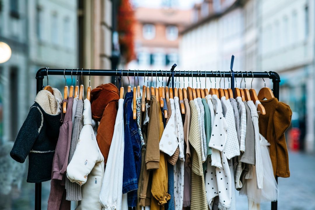 A visually appealing online shopping cart overflowing with colorful baby clothes and accessories.