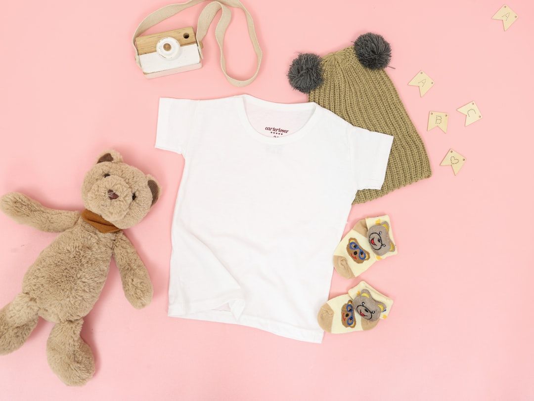 A curated selection of soft, breathable baby clothes, including cotton onesies and lightweight rompers.