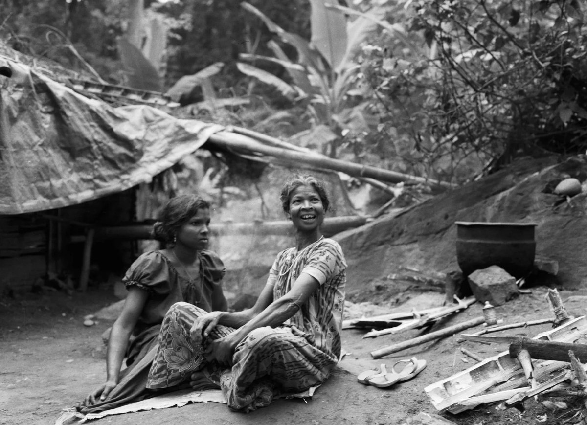 Black and white photograph of two women seated outdoors