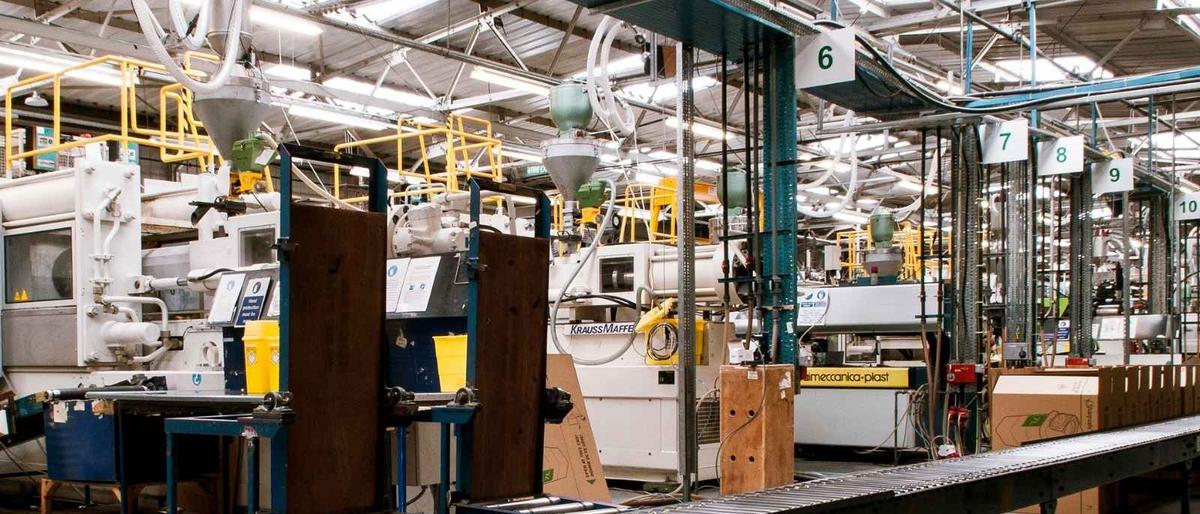 Large-scale UK manufacturing facility with conveyor systems and industrial machinery