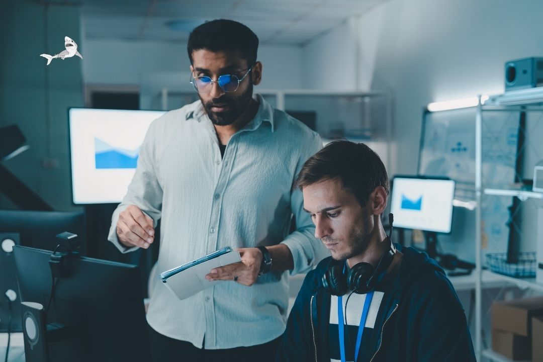 Two people looking at an iPad