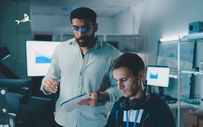 Two people looking at an iPad