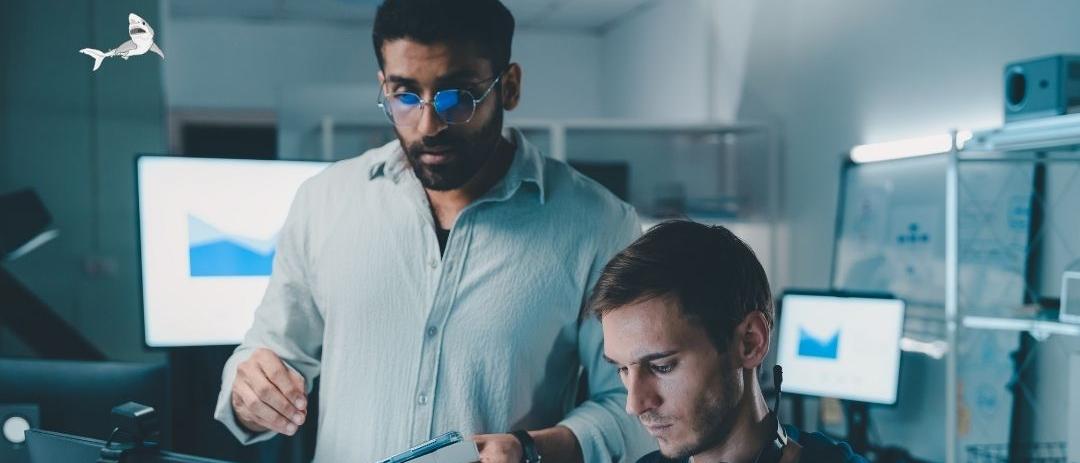 Two people looking at an iPad