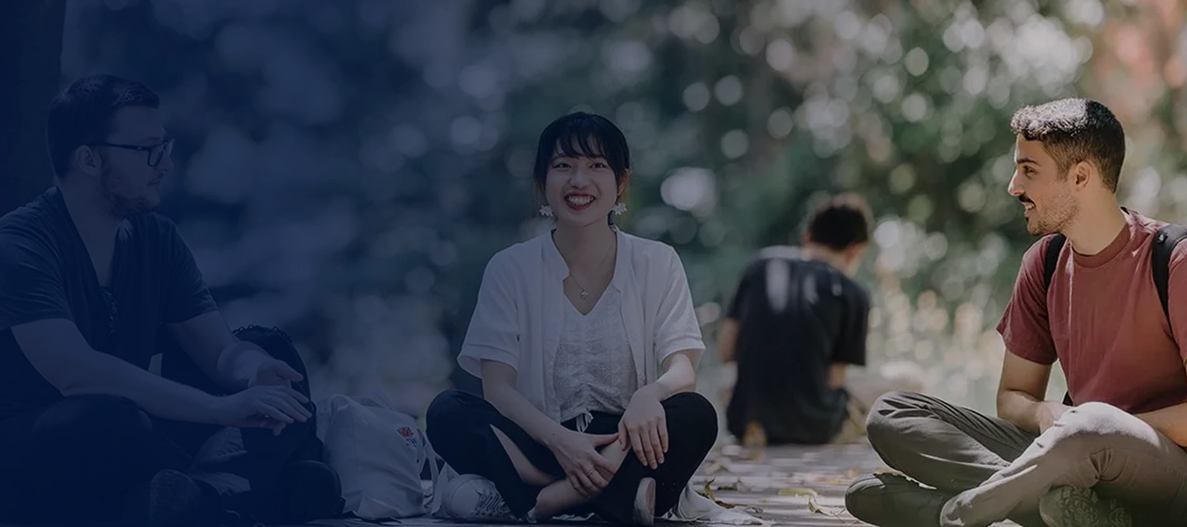 student sitting at a university campus
