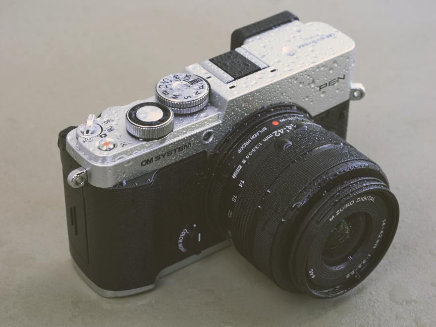 Pen camera sitting on a hard surface.
