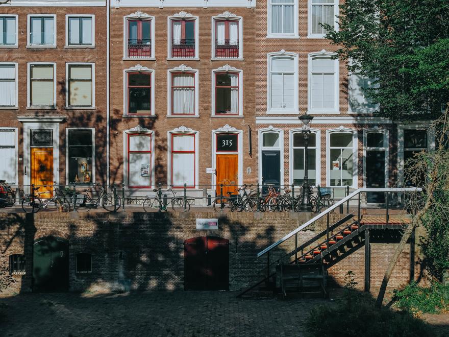 Photo of a city wall with a lot of windows.