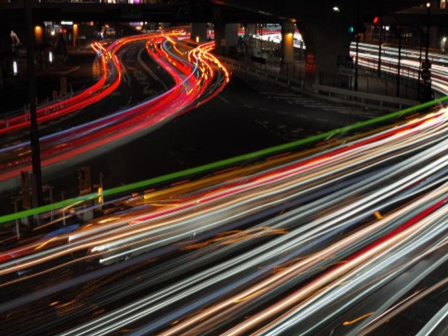 night time photo showing car light trails.