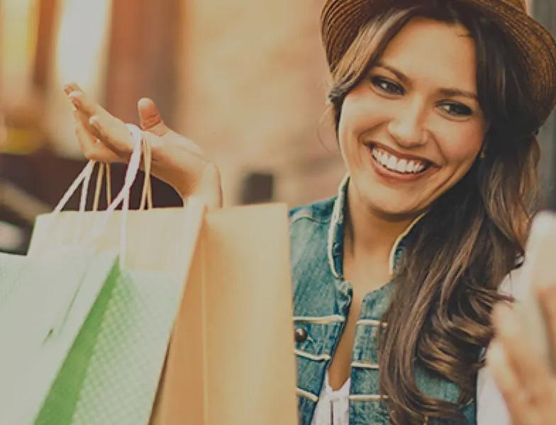 Woman with shopping bags in her hand.