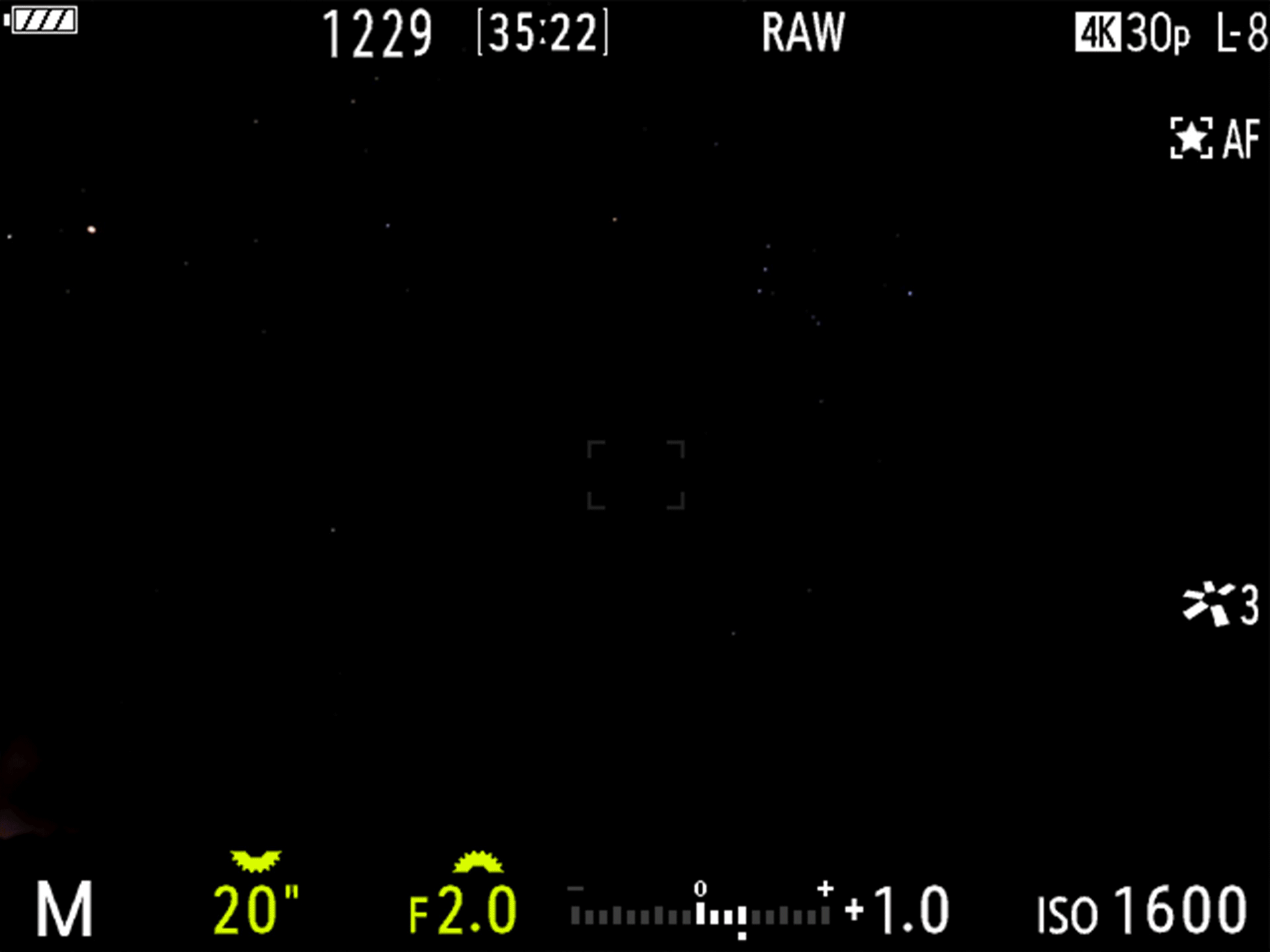 Om-5 Mark ii viewfinder showing a tower in a night sky and how night vision mode works.
