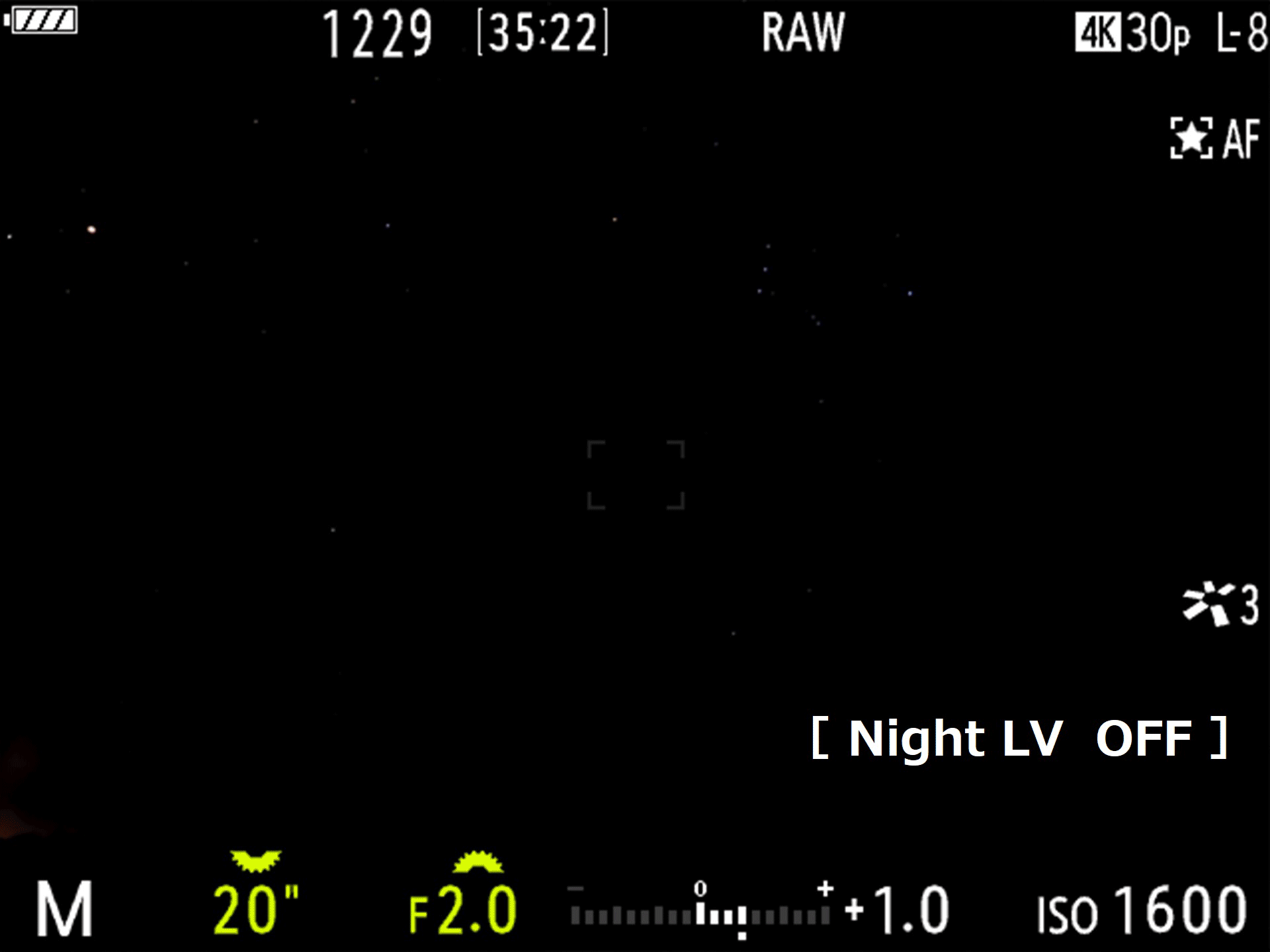 Om-5 Mark ii viewfinder showing a tower in a night sky and how night vision mode works.