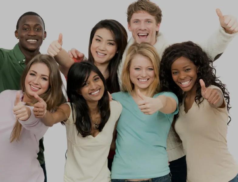 Group of happy people giving the thumbs up.