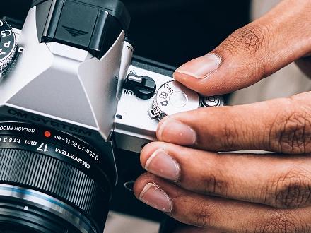 Close up photo of the OM SYSTEM OM-3's Quick & Slow video switch.
