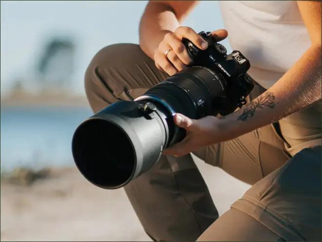 Person holding an OM SYSTEM OM-1 Mark II