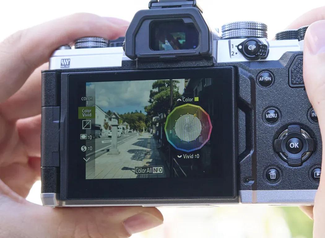 Photo showing the back screen of the OM SYSTEM OM-3 showing the Color and Monochrome profiles.