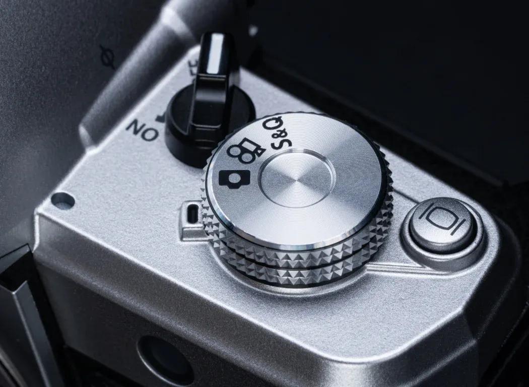Close up photo of the OM SYSTEM OM-3's Quick & Slow video switch.