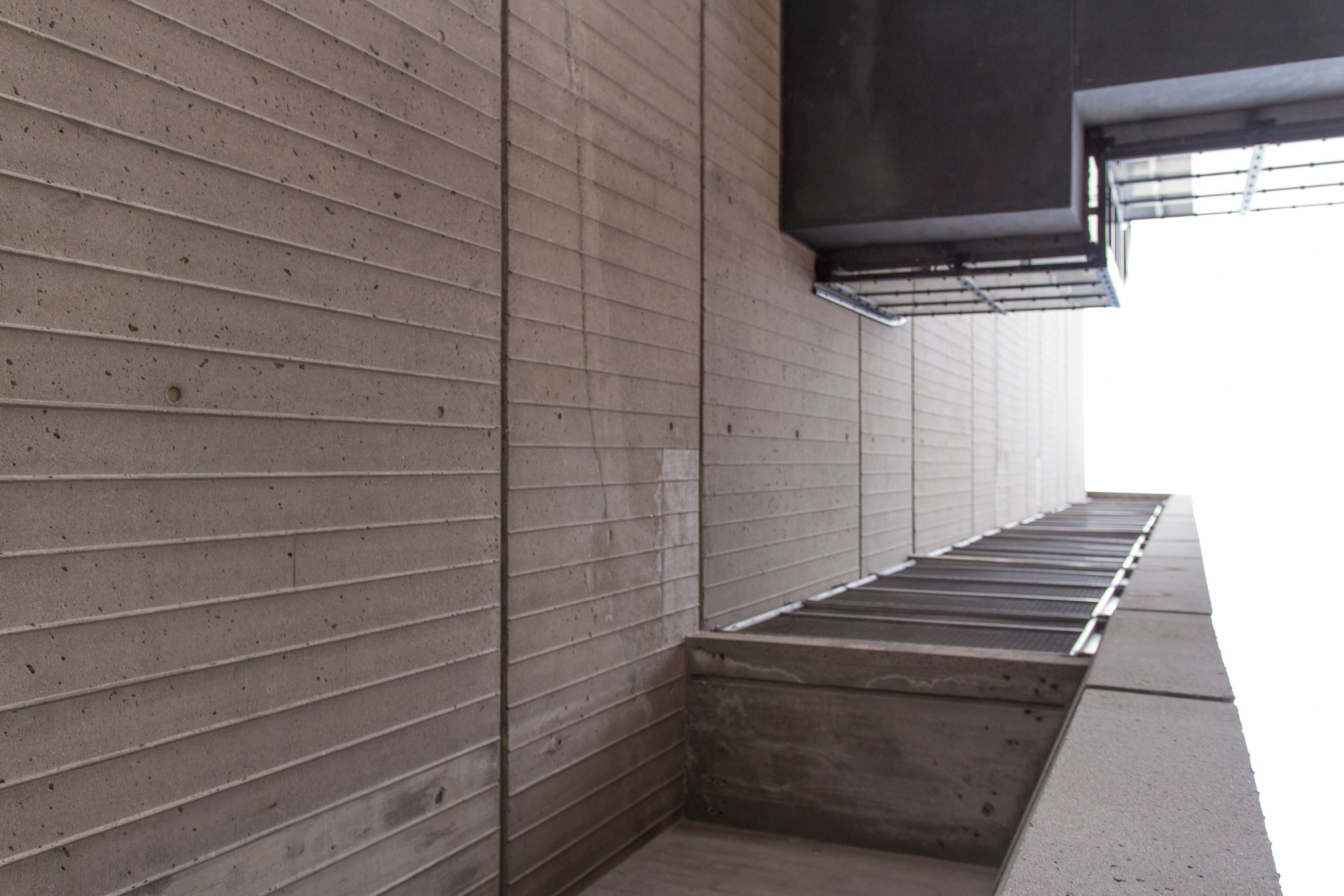 A modern concrete building, photographed at an angle that makes it unclear which way is up.
