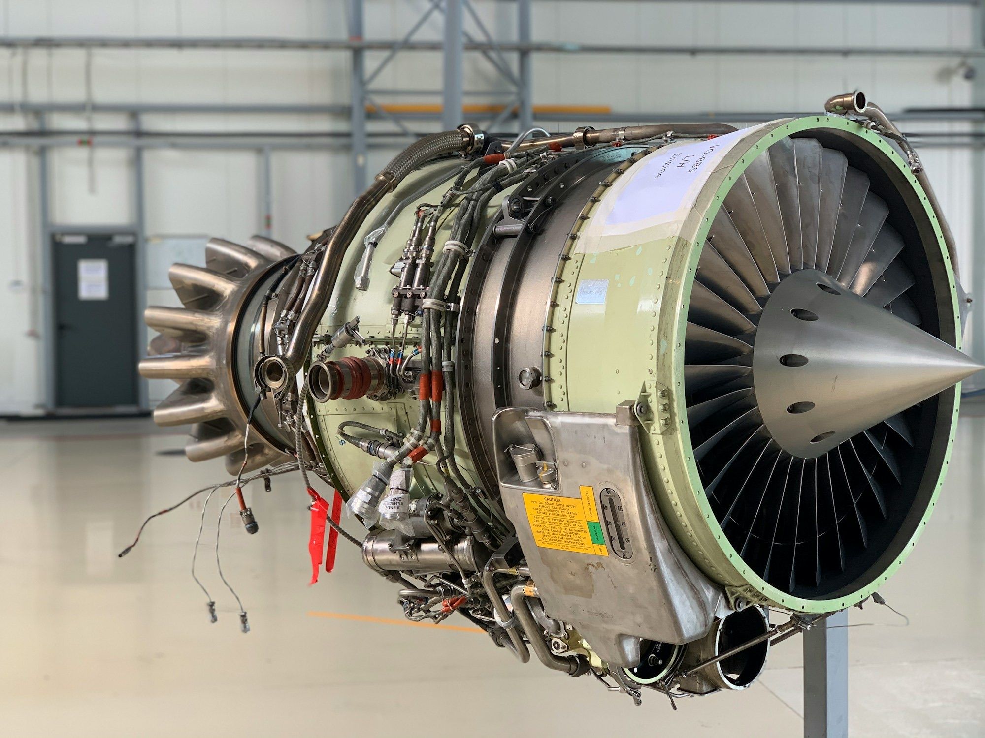 Turbofan engine on a stand in a maintenance hangar