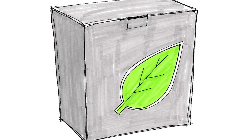 A plain cardboard box with a crooked bright green leaf sticker on the front.