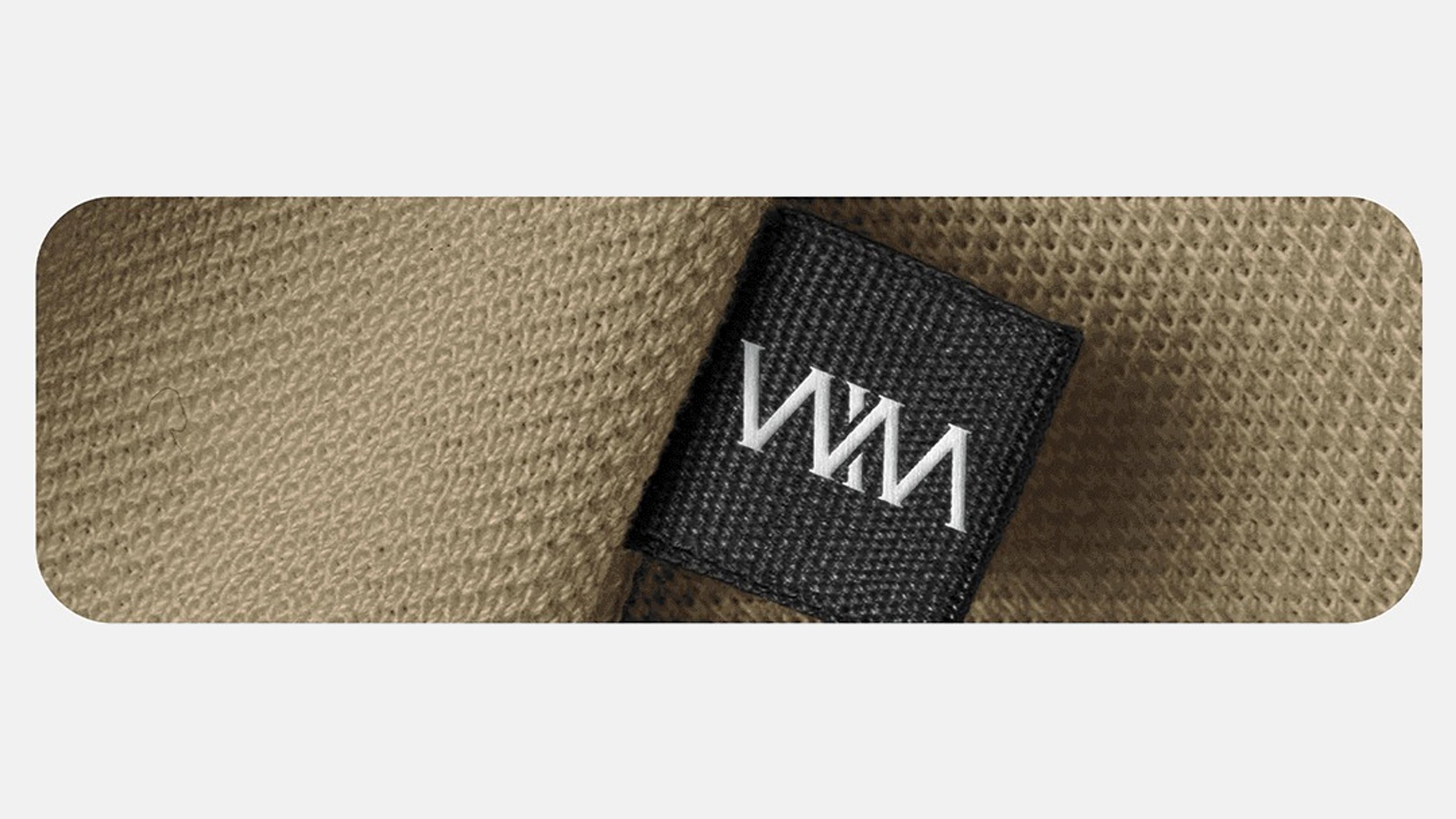Woven monogram label on a knit fabric
