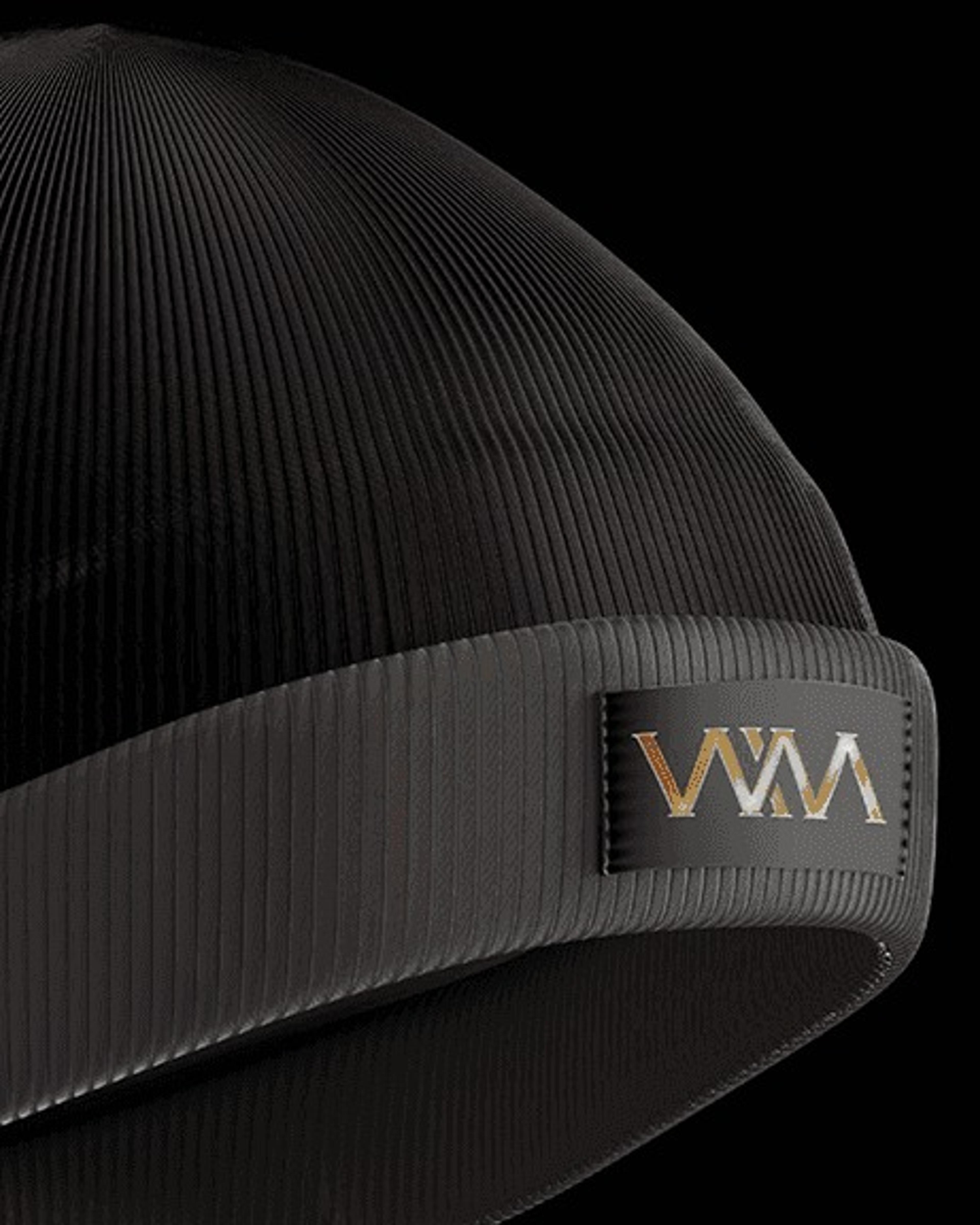 Black ribbed beanie with a gold monogram patch