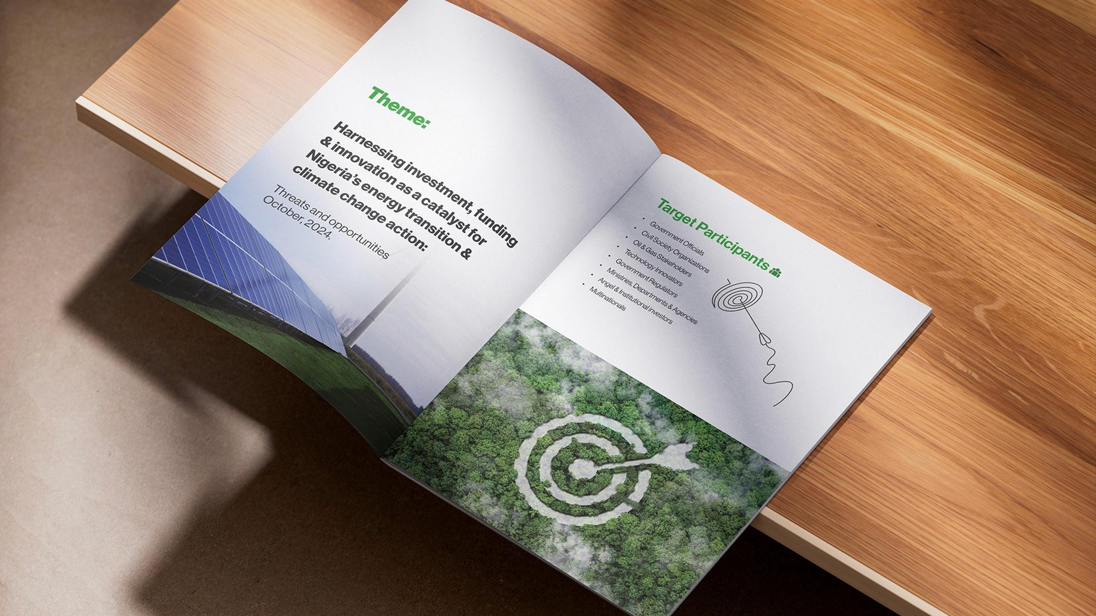 Open TED Summit brochure spread on a wooden table