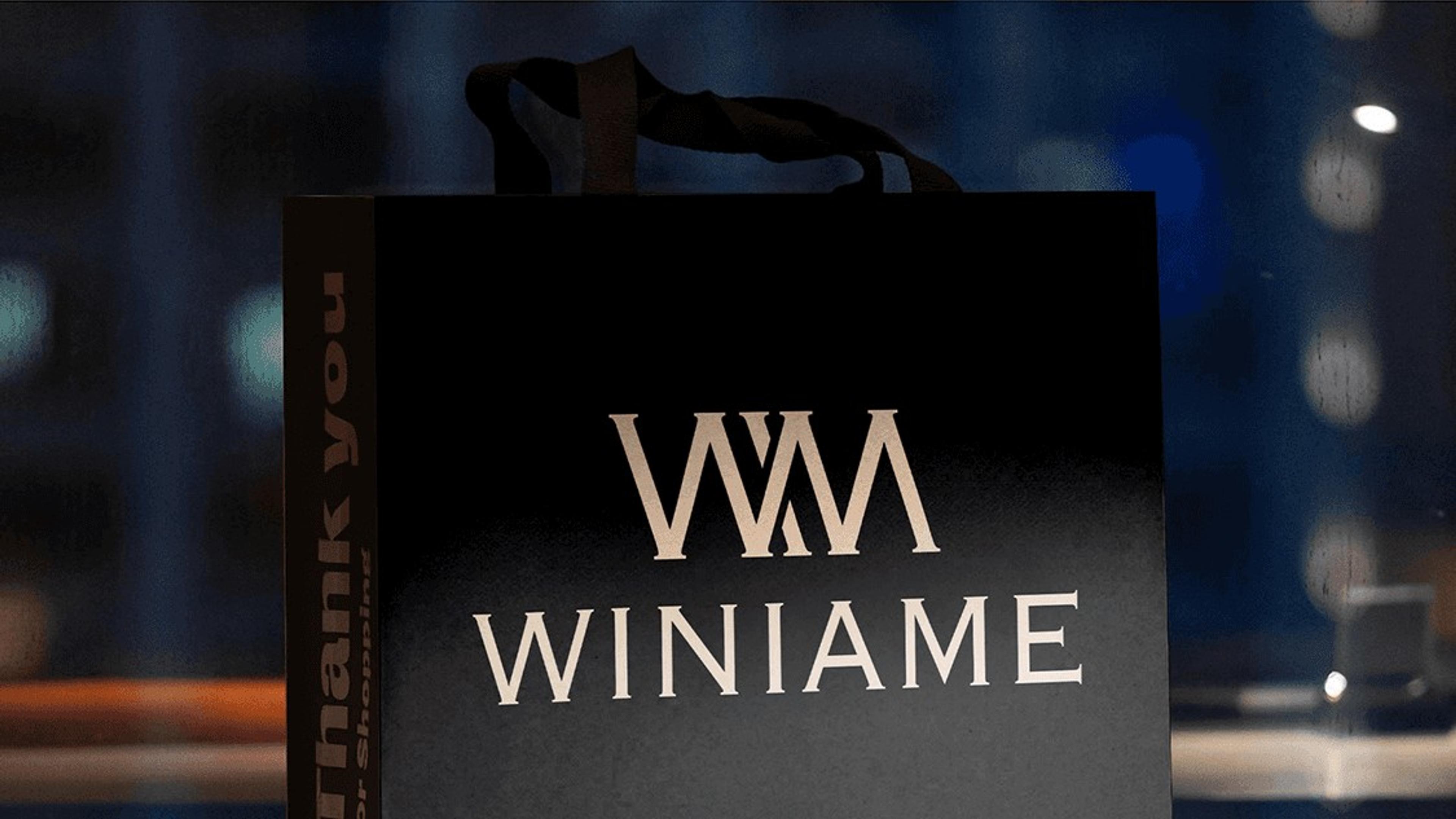 Black Winiame shopping bag with the gold WM monogram