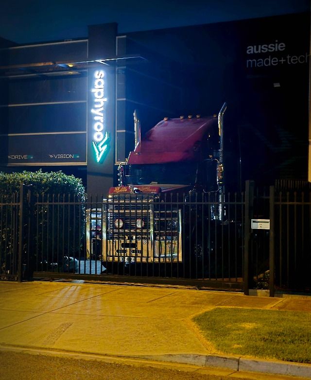 A Saphyroo-wrapped truck outside HQ at night