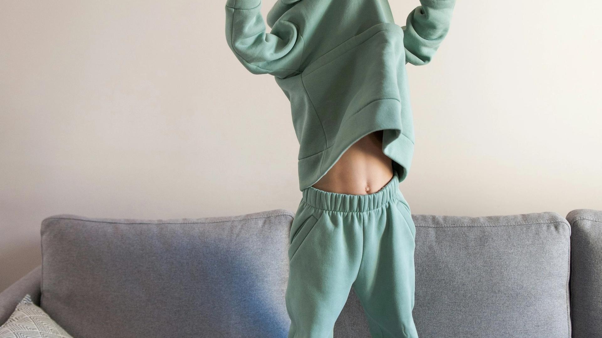 preschooler standing on couch