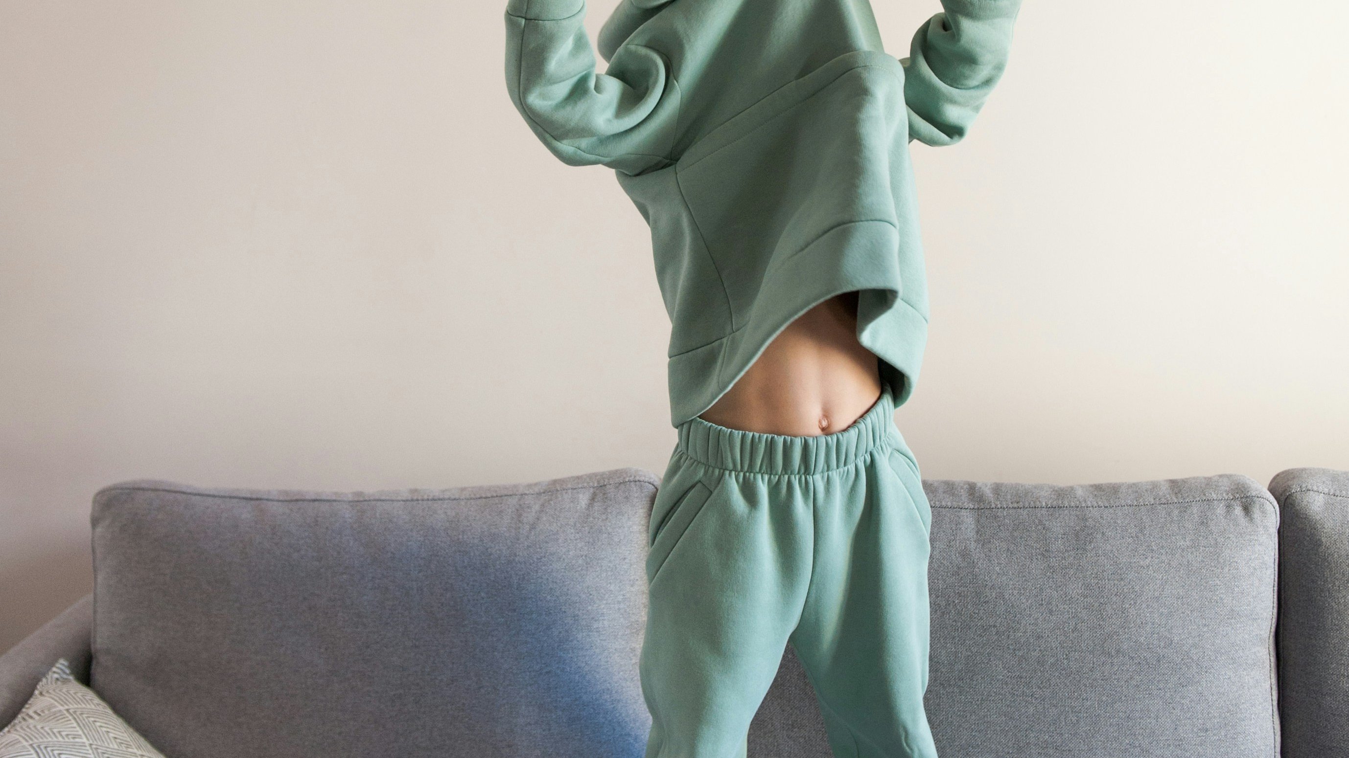 preschooler standing on couch