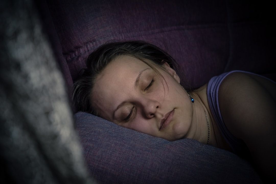 Beautiful young woman sleeping on the lilac sofa. Tired person after work. More of my photos and videos Adobe Stock:http://bit.ly/3RqlciK More of my photos and videos Shutterstock: https://www.shutterstock.com/g/ALEKSANDRBERDYUGIN My email: bermix999@gmail.com - Photo by Bermix Studio on Unsplash