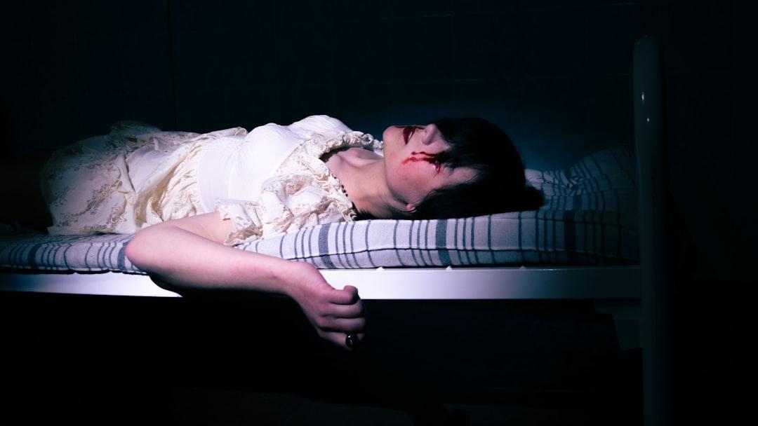 a girl in a white dress in a mental hospital, a member of a musical group, horror - Photo by Елизавета Крылова on Unsplash