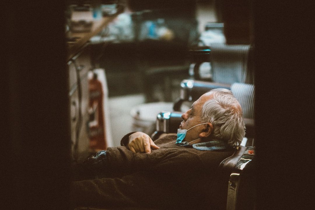 man in black long sleeve shirt lying on bed - Photo by Jon Tyson on Unsplash