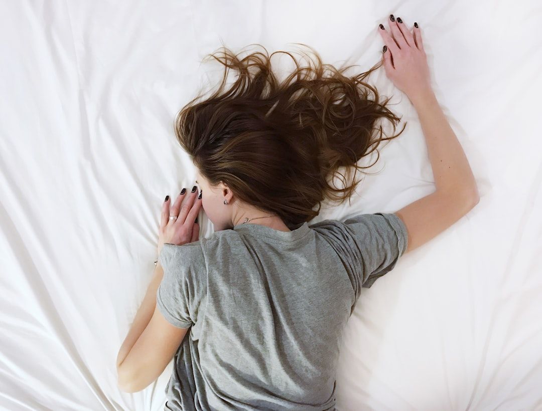 Woman lying face down - Photo by Vladislav Muslakov on Unsplash