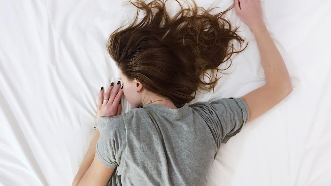 Woman lying face down - Photo by Vladislav Muslakov on Unsplash