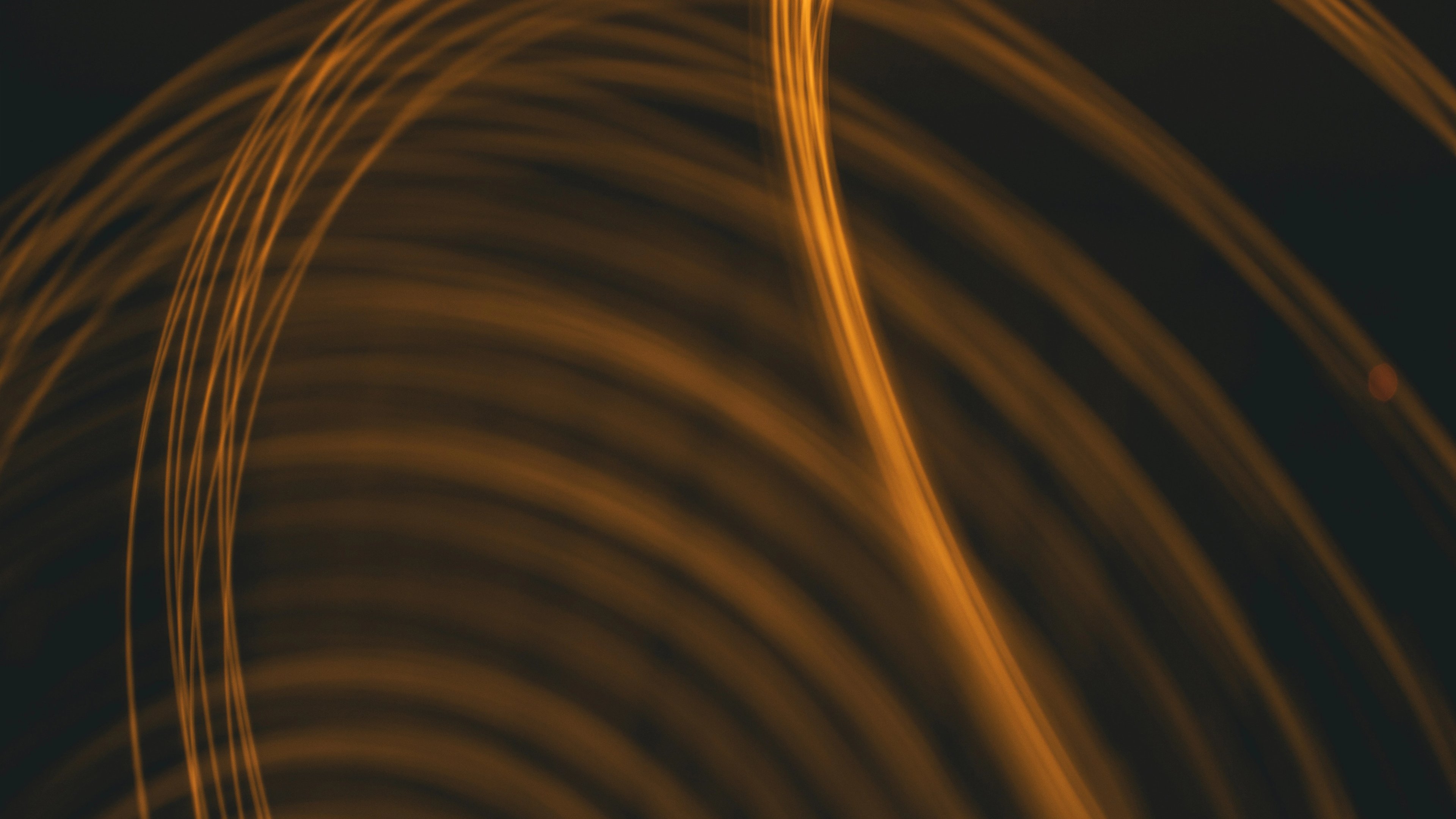 a close up of a swirl of light on a black background