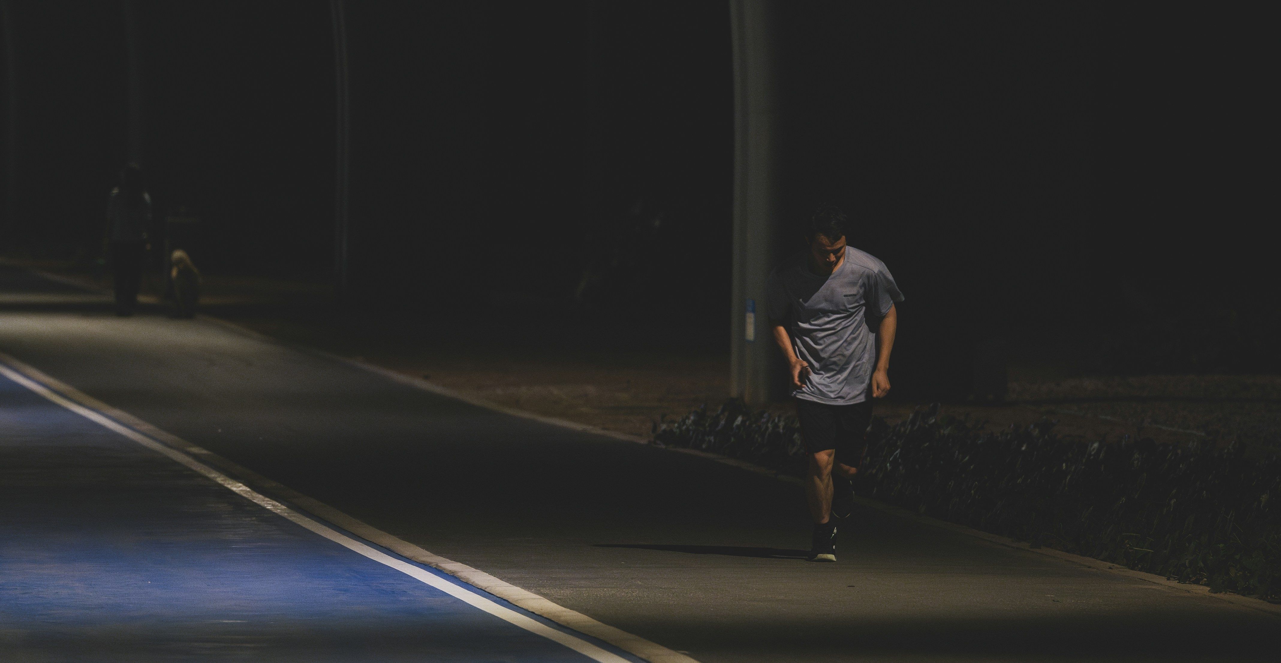 man jogging in the dark
