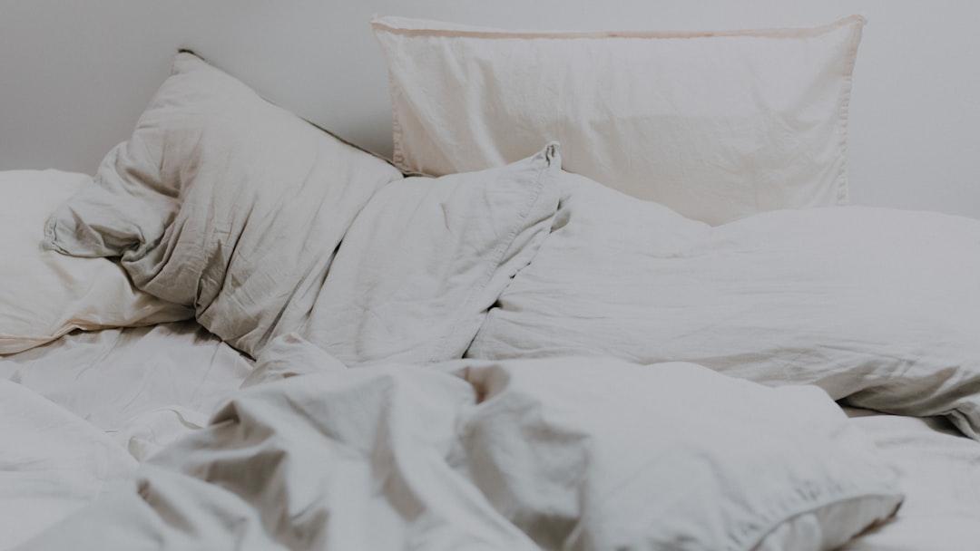 Best sleeping position for lower back pain — side sleeper with knee pillow support