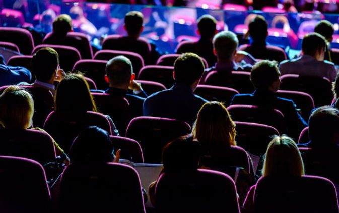 people sitting in hall