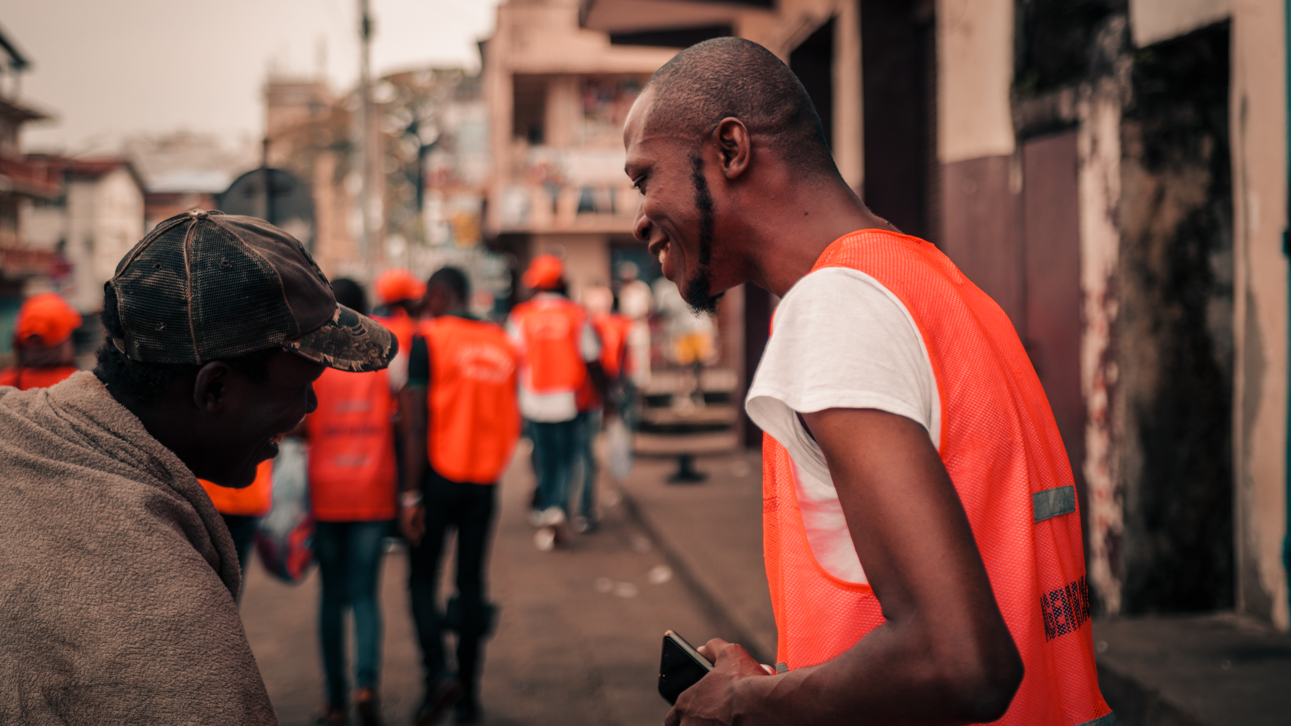 Sierra Leone Social Workers founder smiling with another person
