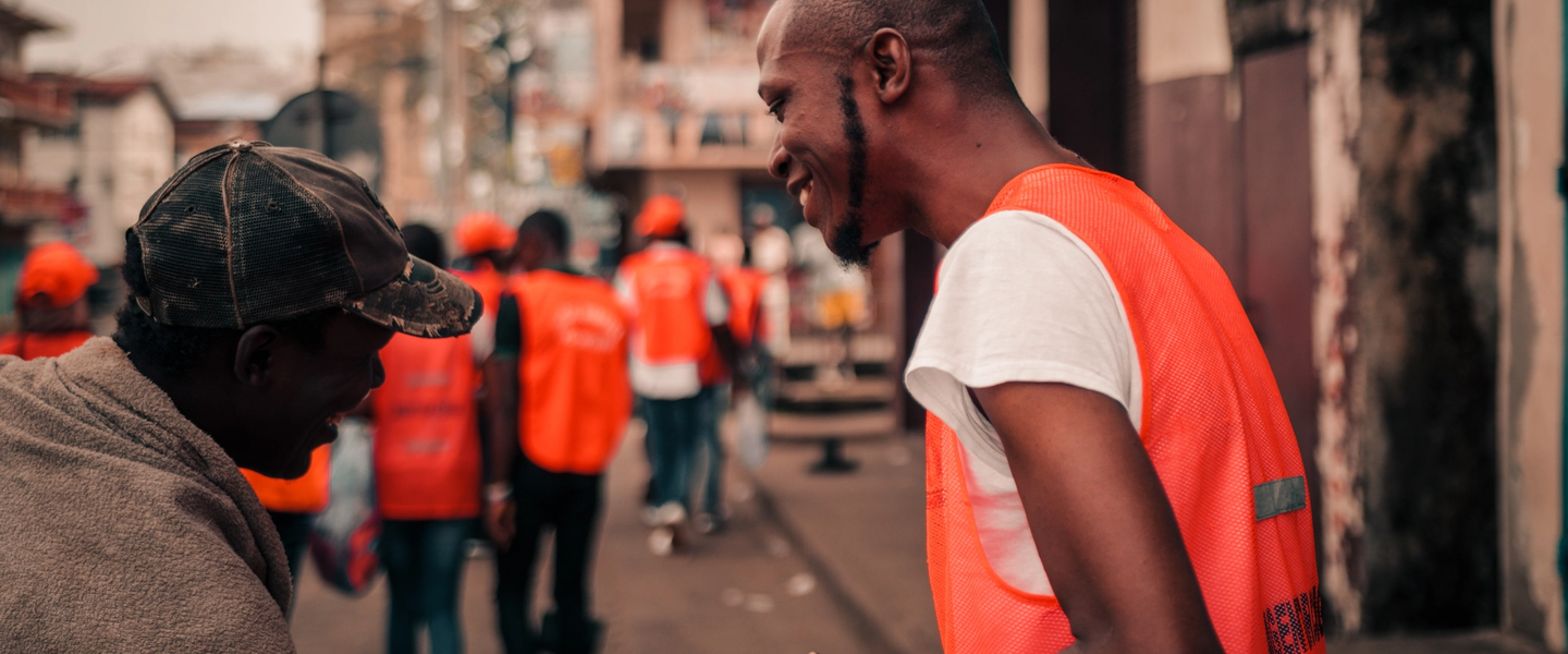 Sierra Leone Social Workers founder smiling with another person