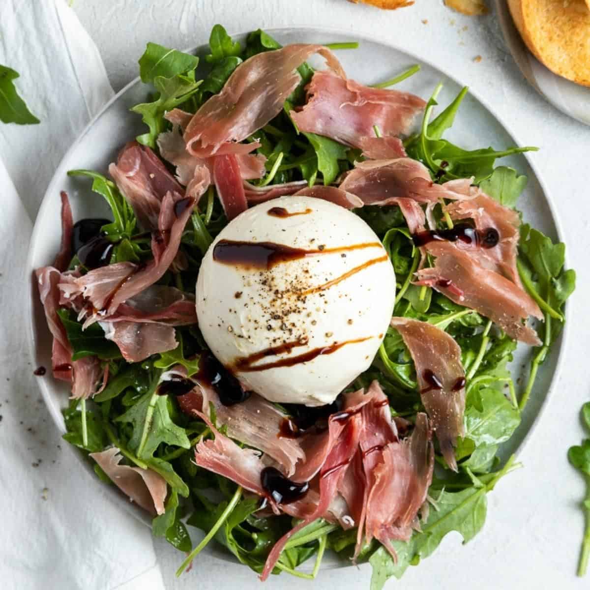 Burrata con prosciutto