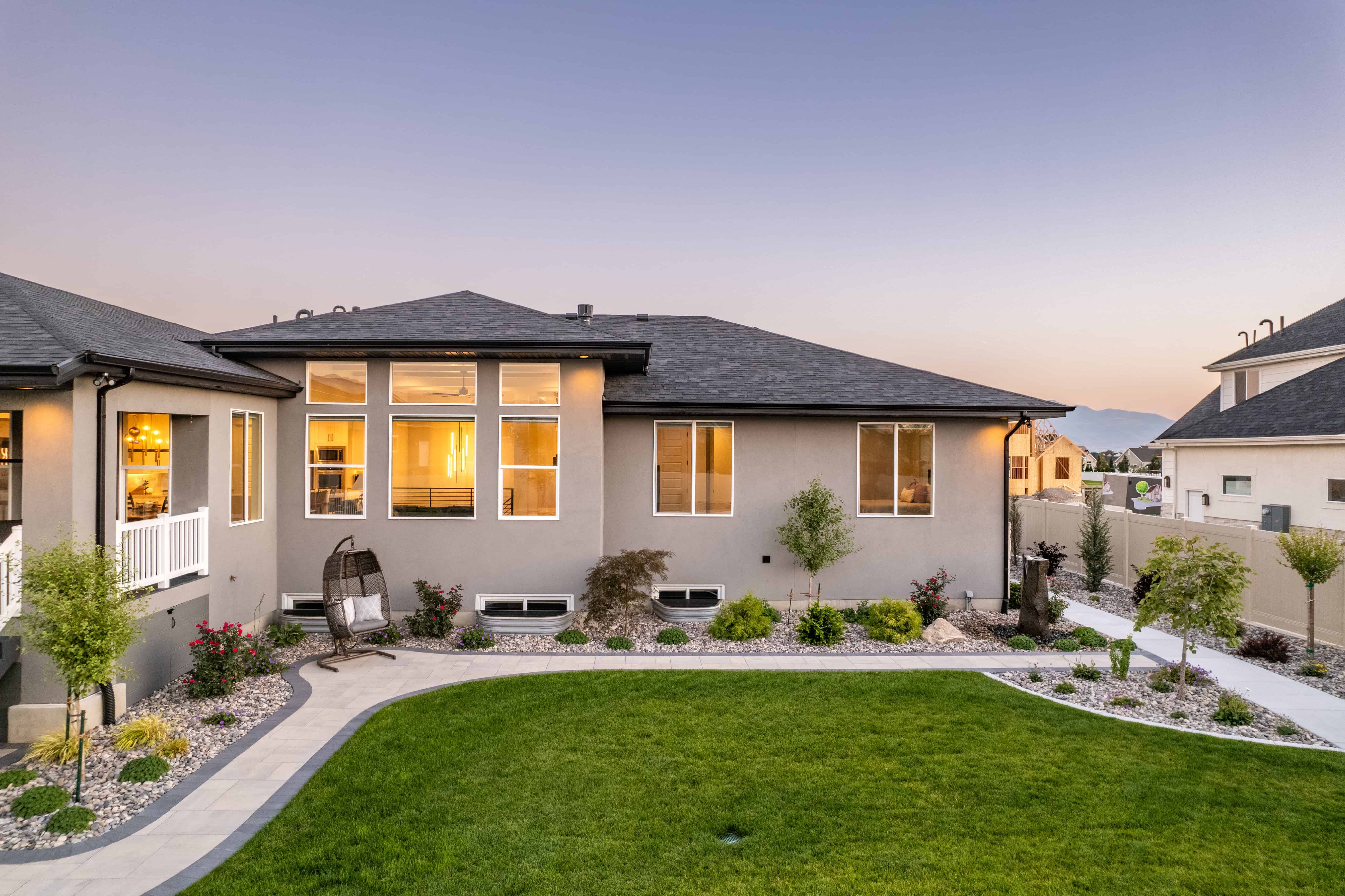 Paver walkway leading through a landscaped garden with a water feature in Lehi, Utah. | Pavers Installation