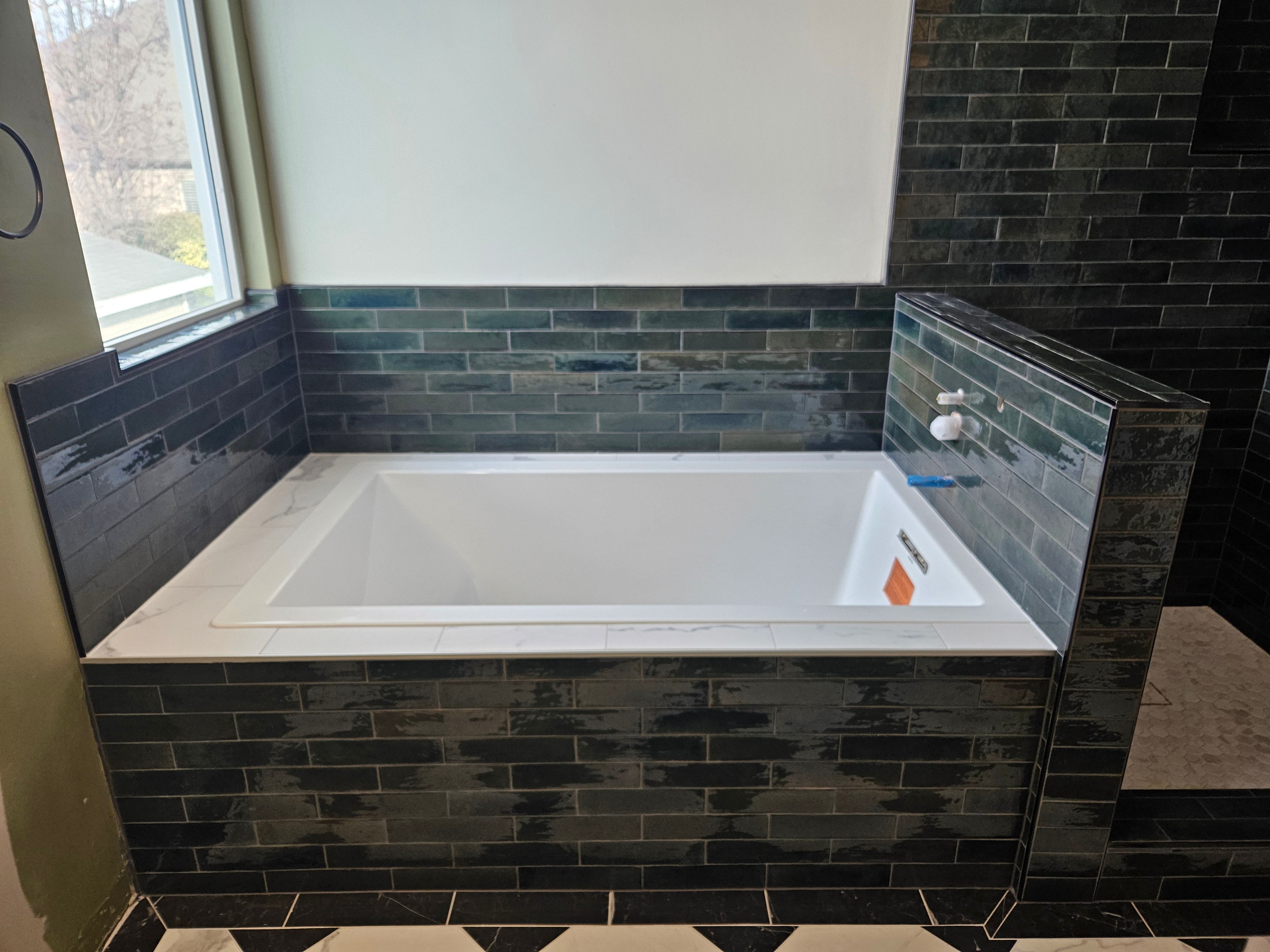 Finished tile tub surround in a Murray, Utah bathroom remodel.